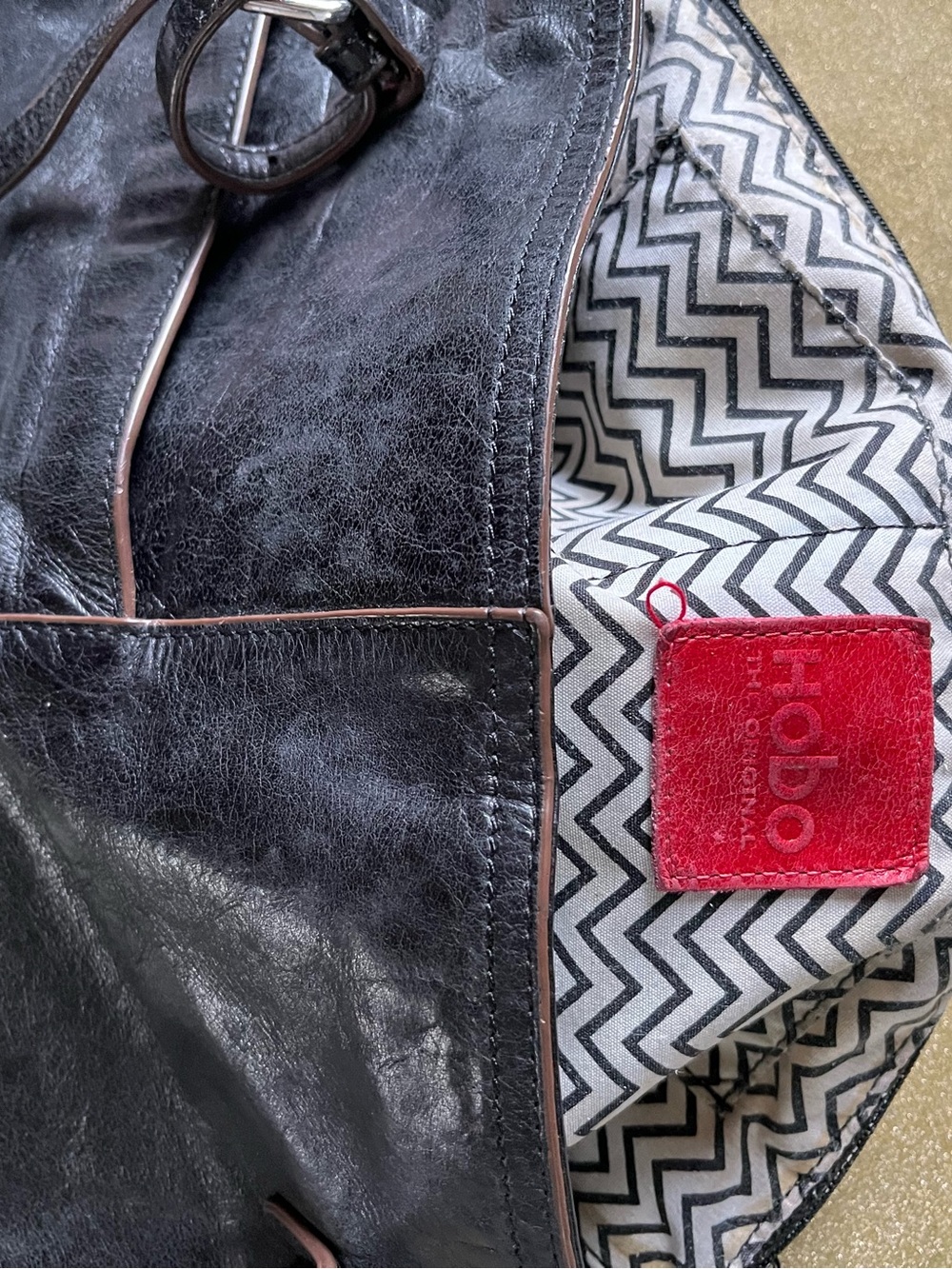 HOBO Black Leather Messenger with Chevron Interior and Red Label